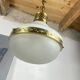 Suspension in white opaline glass and brass 1920 with a gilded brass chain.
