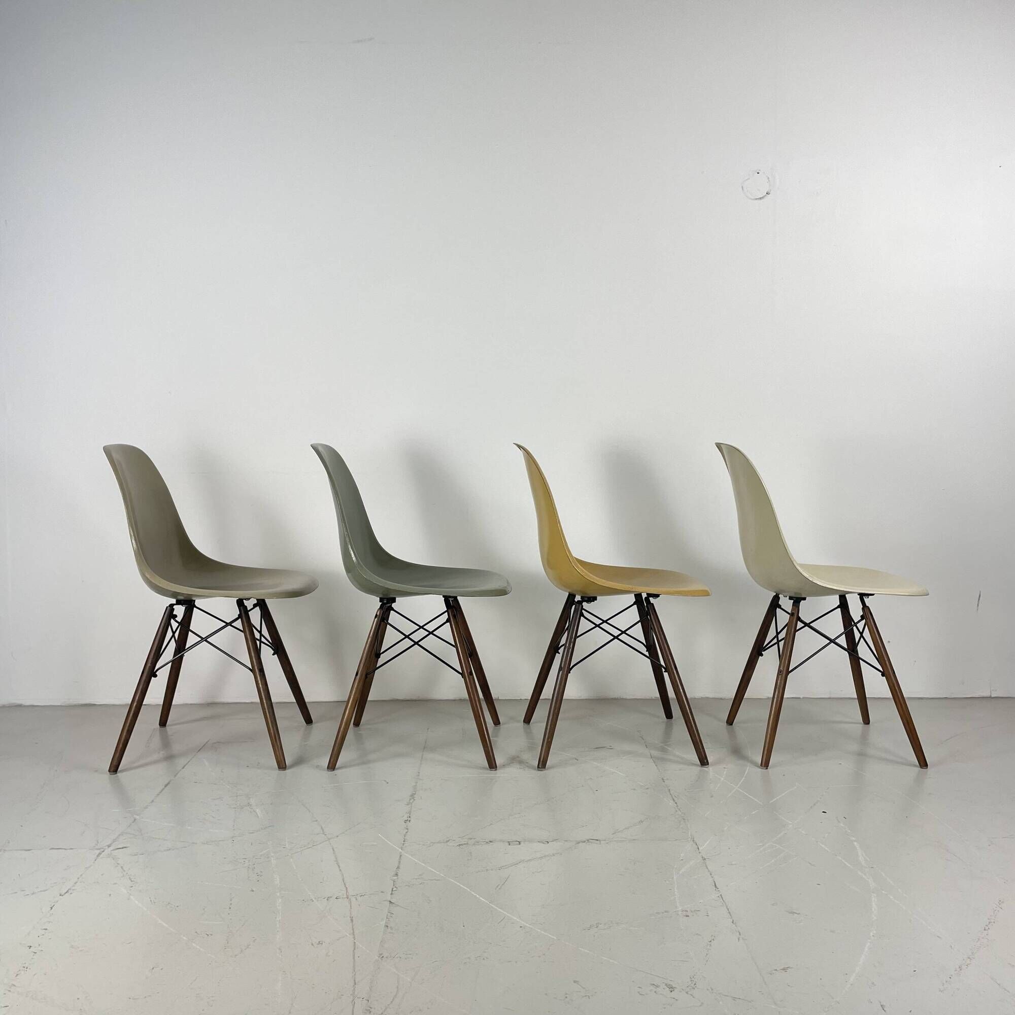 Eames Herman Miller DSW side chairs in greige, seafoam green, light ochre and parchment with slight