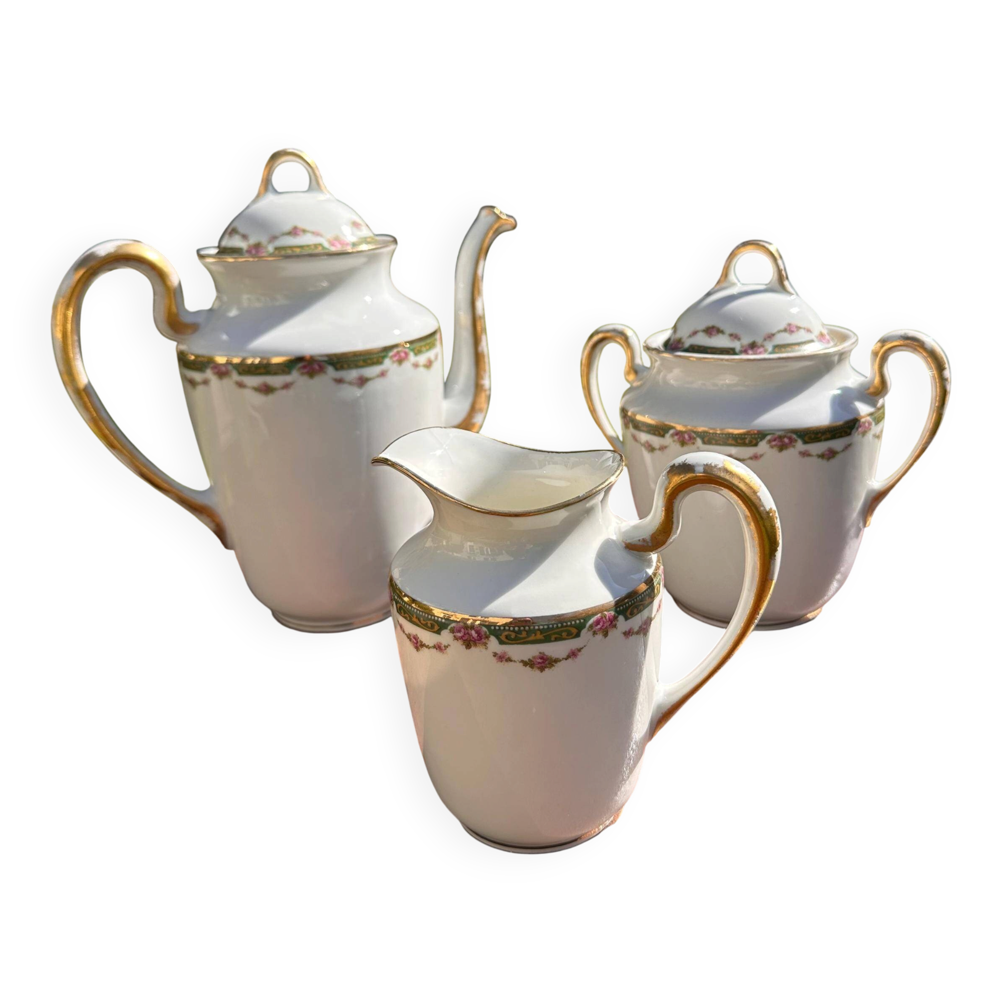 Set of jug, sugar bowl, and milk jug in Limoges porcelain by Paul Past.
