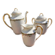 Set of jug, sugar bowl, and milk jug in Limoges porcelain by Paul Past.