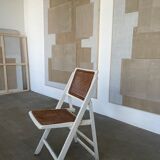 4 folding chairs with wicker seating