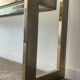 Console "G" by Belgochrom in brass and glass from the 1970s.