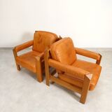 2 fauteuils en chêne et cuir cognac par Skilla