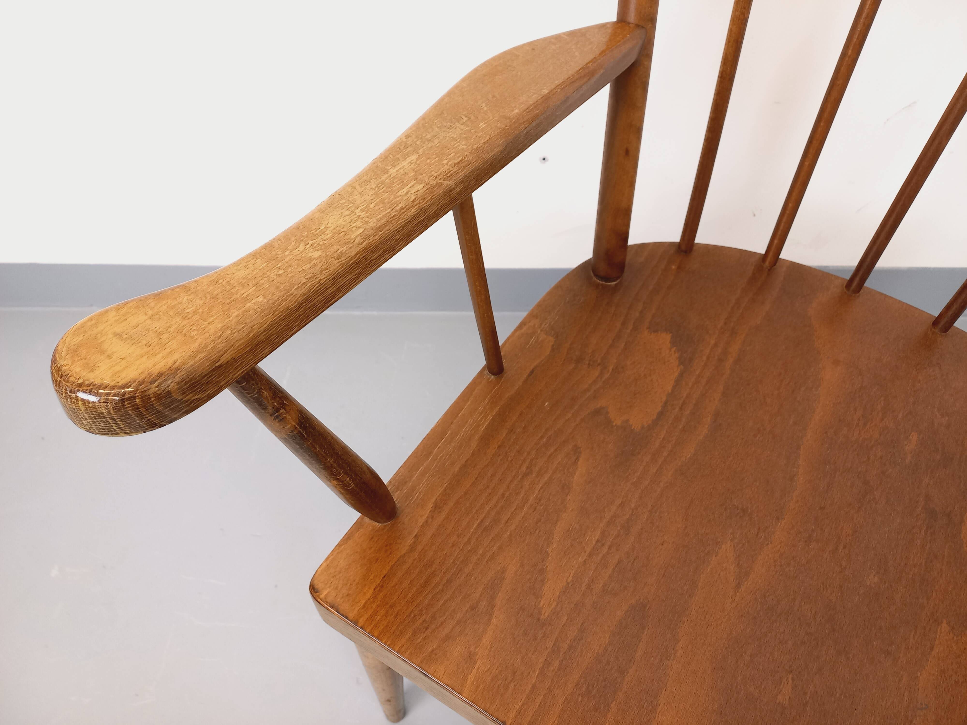 Vintage wooden armchair Baumann model Éventail from the 1960s.