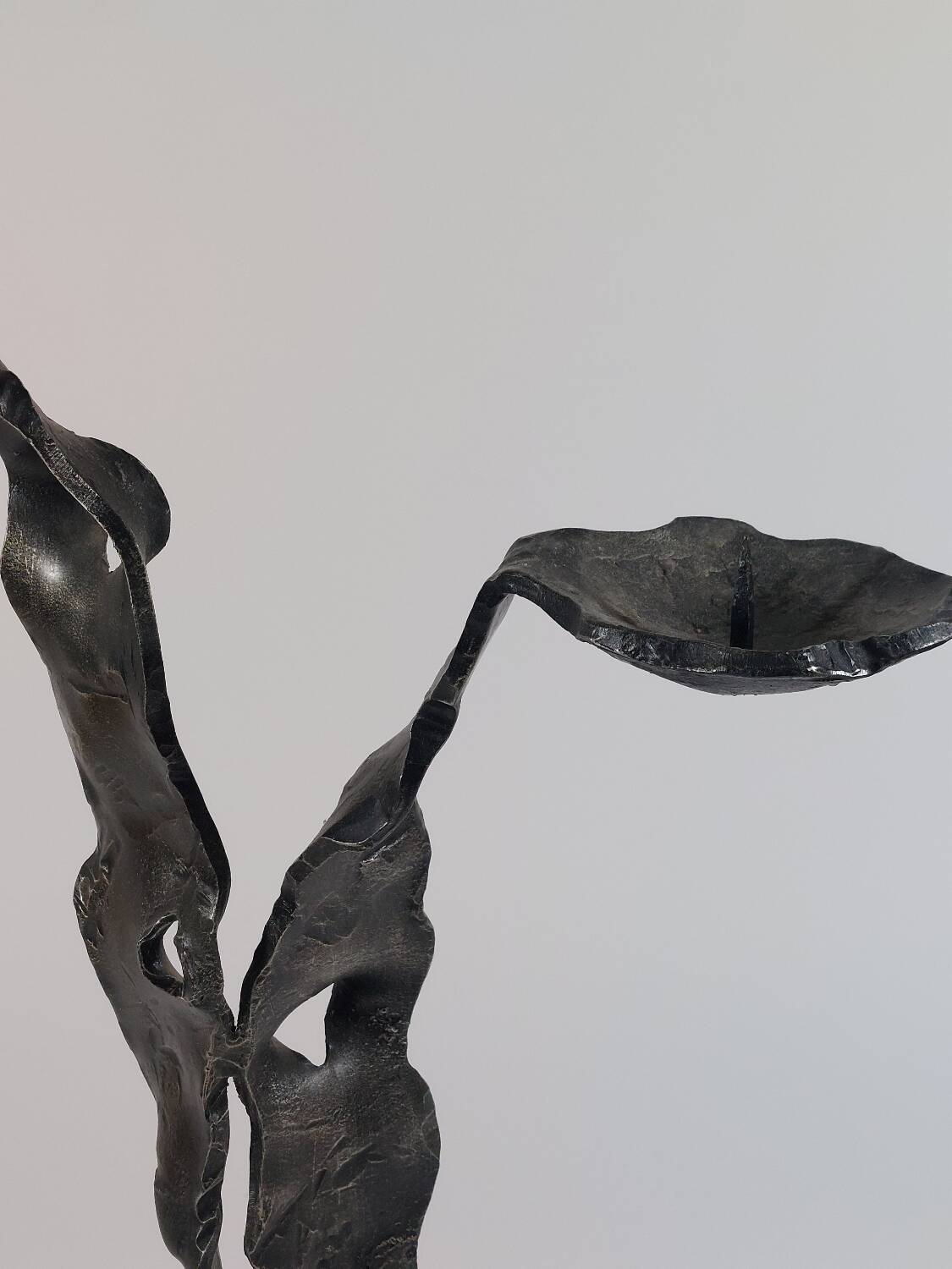 Sculptural brutalist floor candle holder made of hand-forged iron from the 1950s.