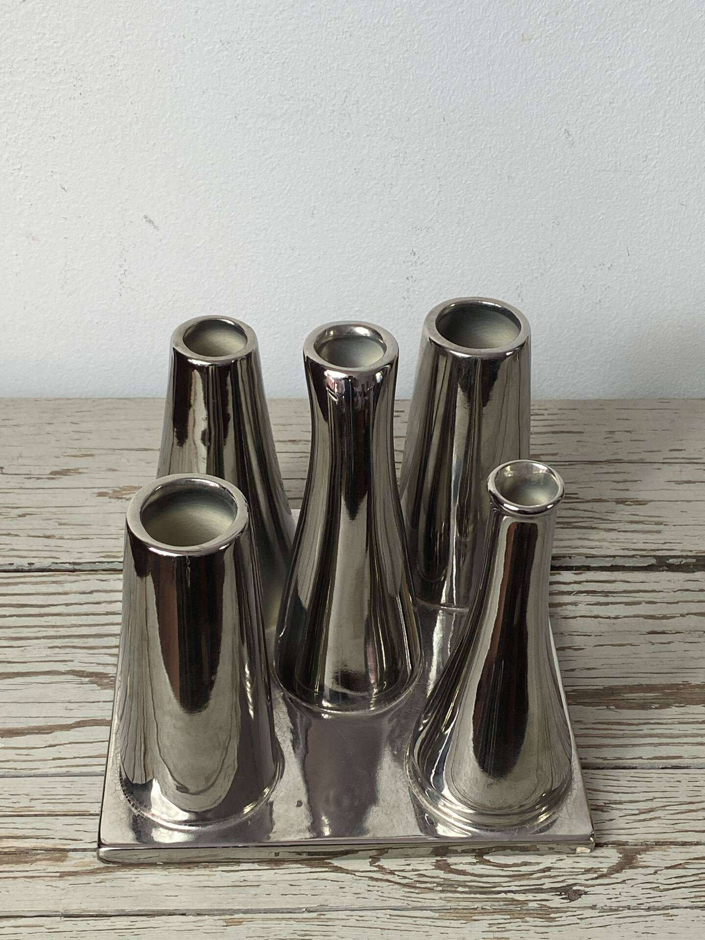 Asymmetrical multitube vase on a base, in silvered ceramic, 1970.