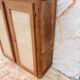 Armoire basse en bois brut et raphia tressé