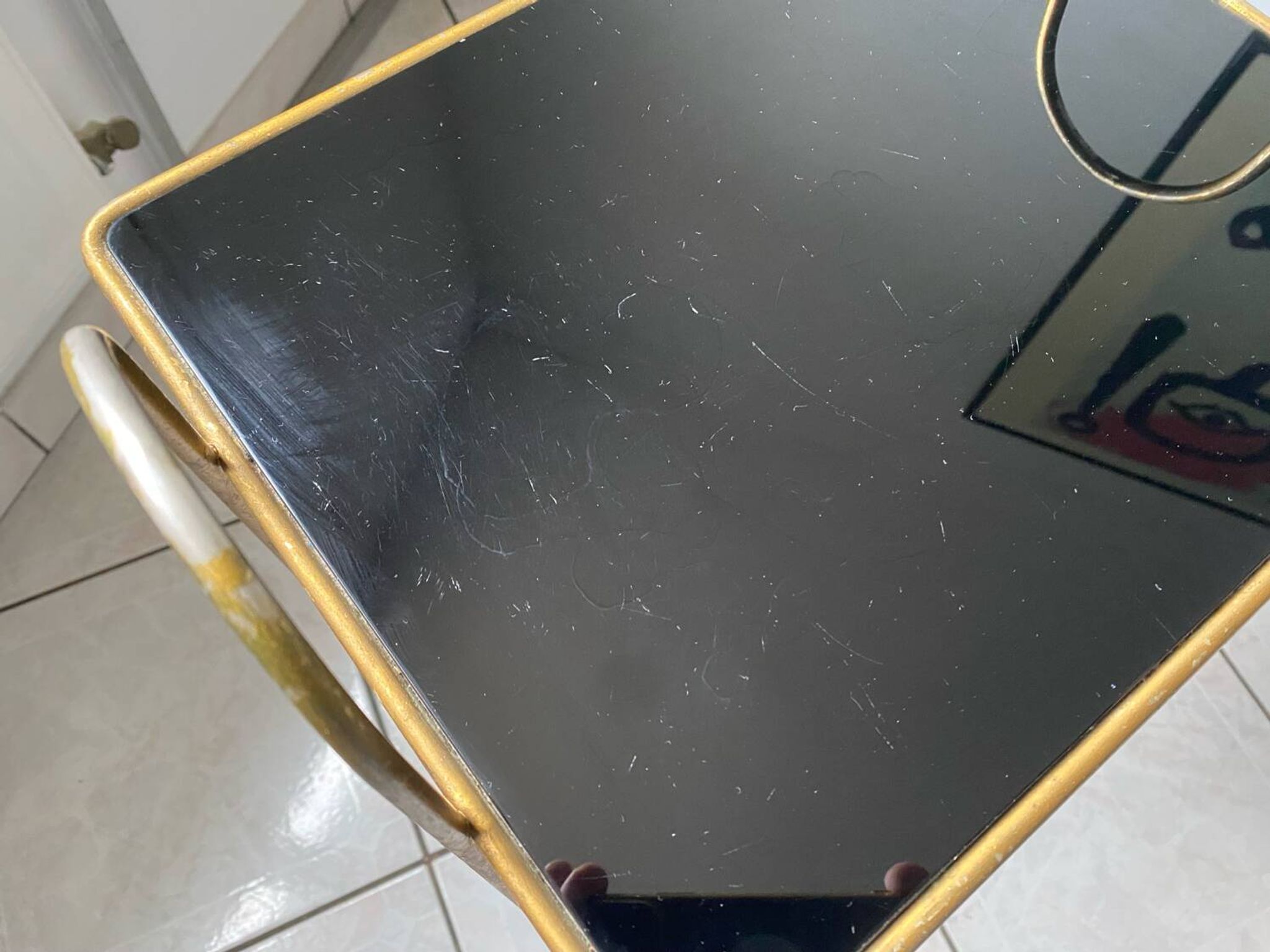 Vintage 1960s brass and smoked glass side table with magazine holder.