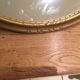Miroir ovale en bois doré 67x47cm
