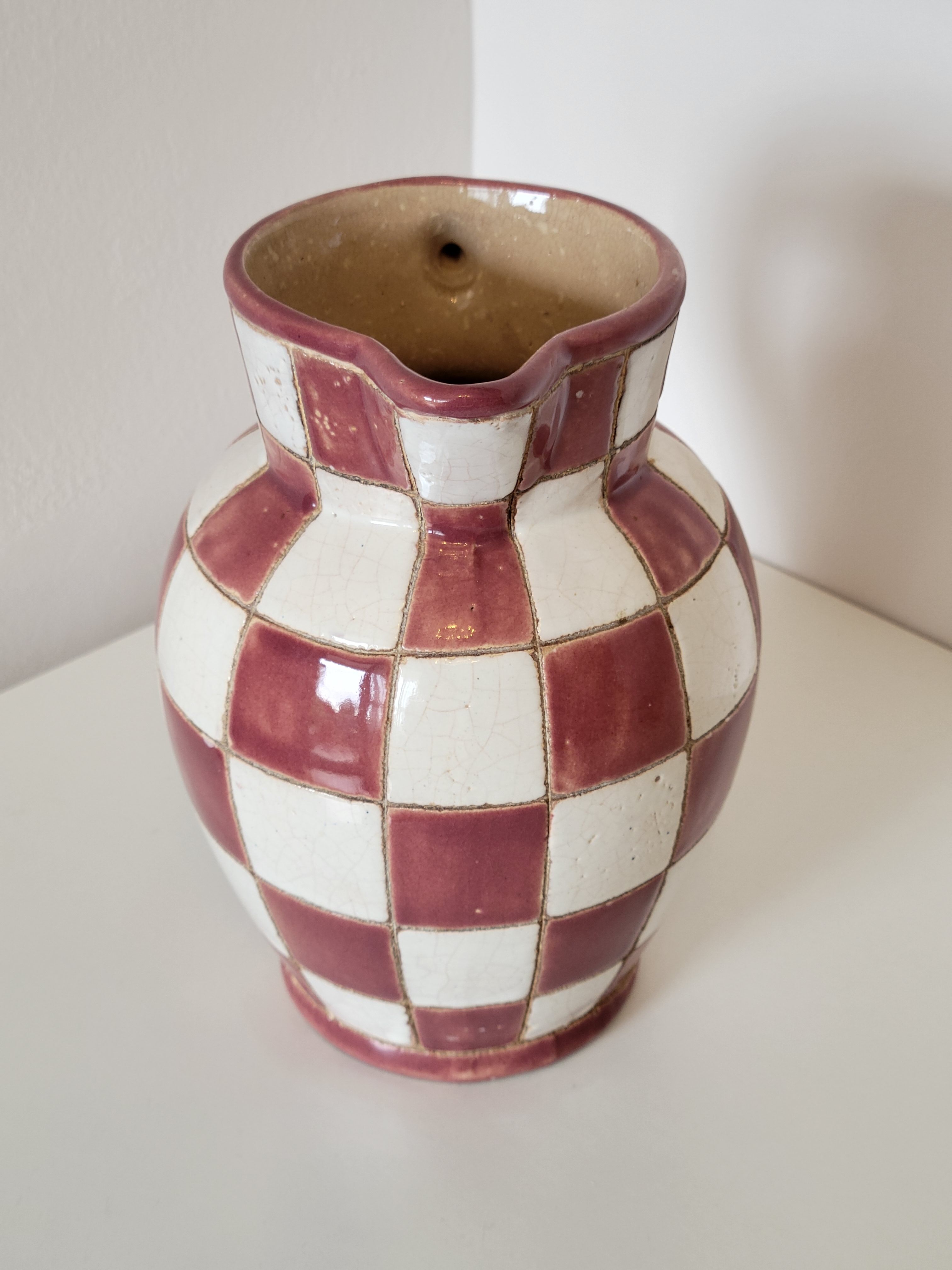 Old ceramic pitcher pattern checkerboard tiles