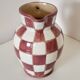 Old ceramic pitcher pattern checkerboard tiles