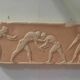 Bas-relief in the antique style featuring athletes.