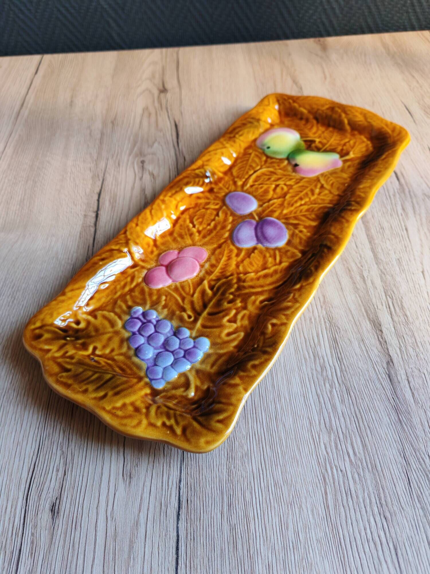 Vintage barbotine pocket dish from Salins les Bains, relief decoration of fruits.