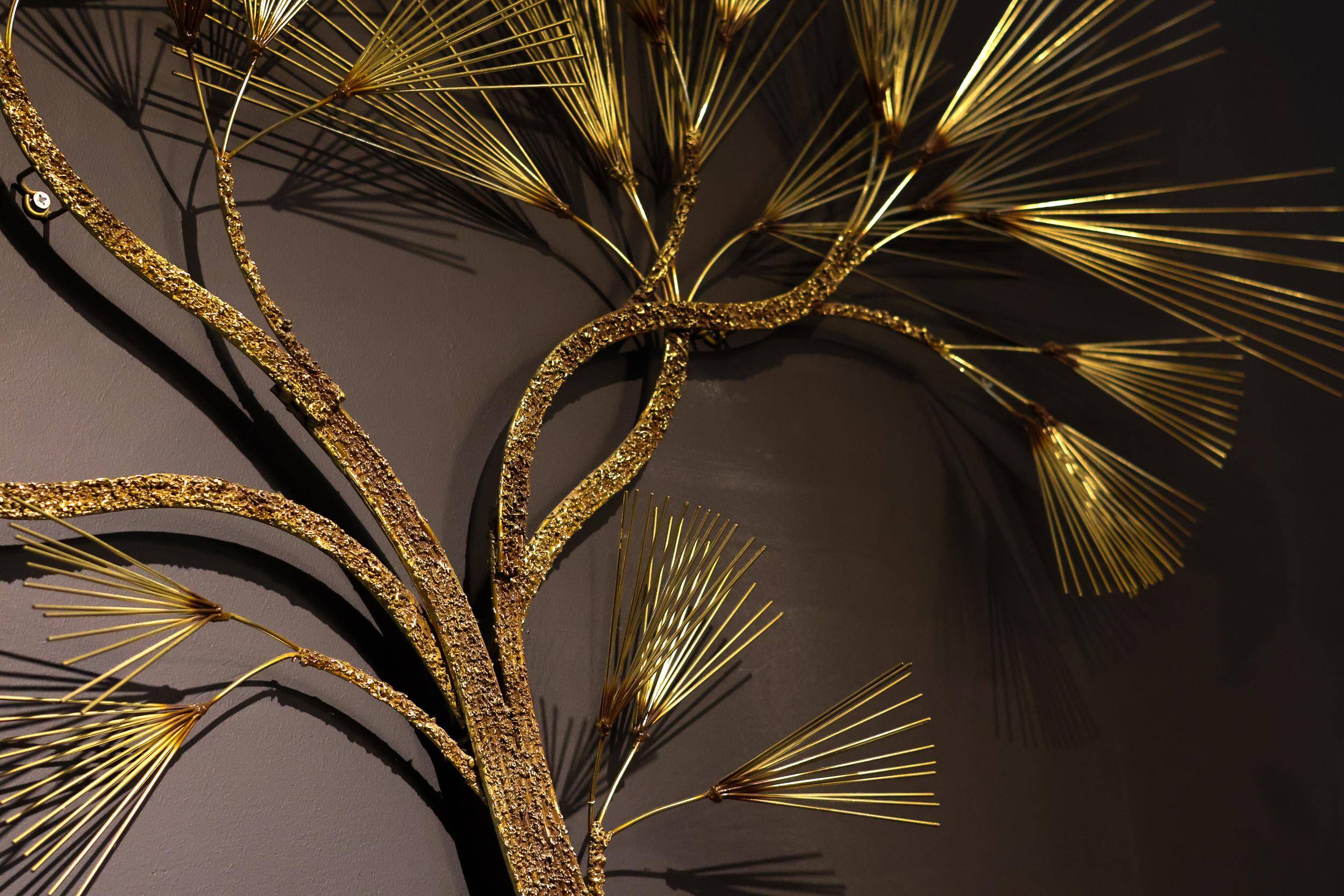 Large wall sculpture in the shape of a tree needle in brass by Curtis Jeré, mid-century modern.
