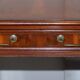 Partner desk with double pedestal in burr yew wood with decorated top.