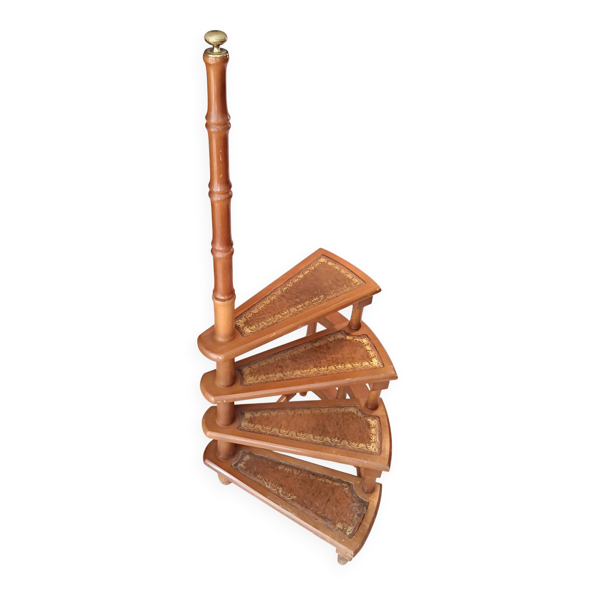 Library spiral staircase in beech and brown leather.