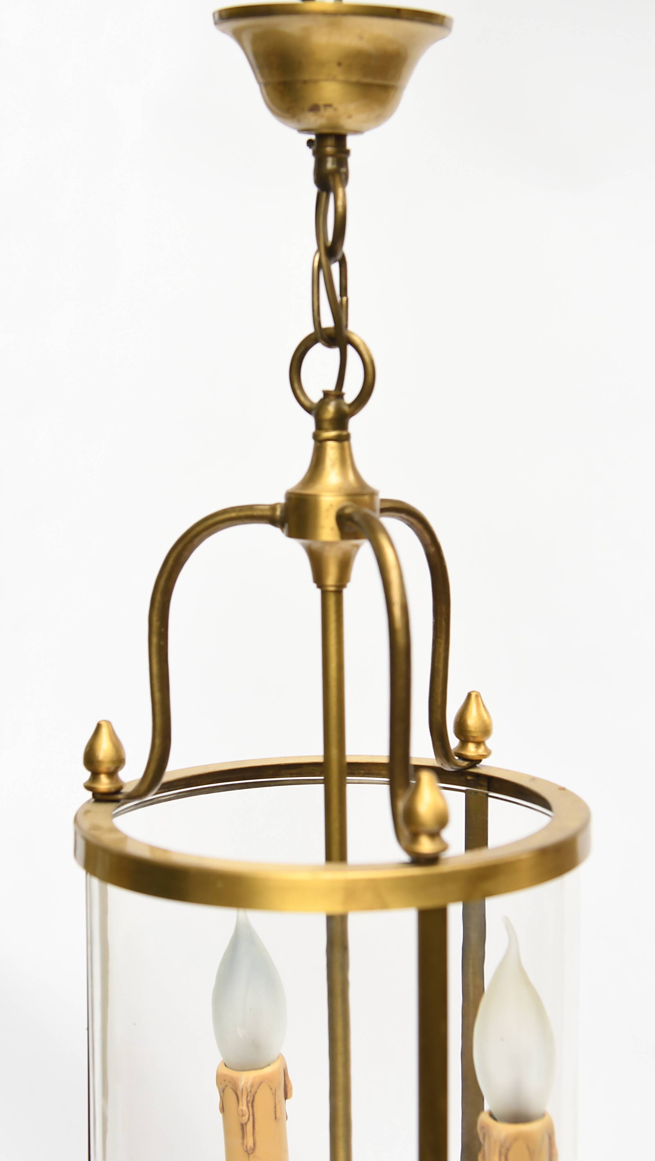 Pair of lanterns with three lights in gilded metal and glass