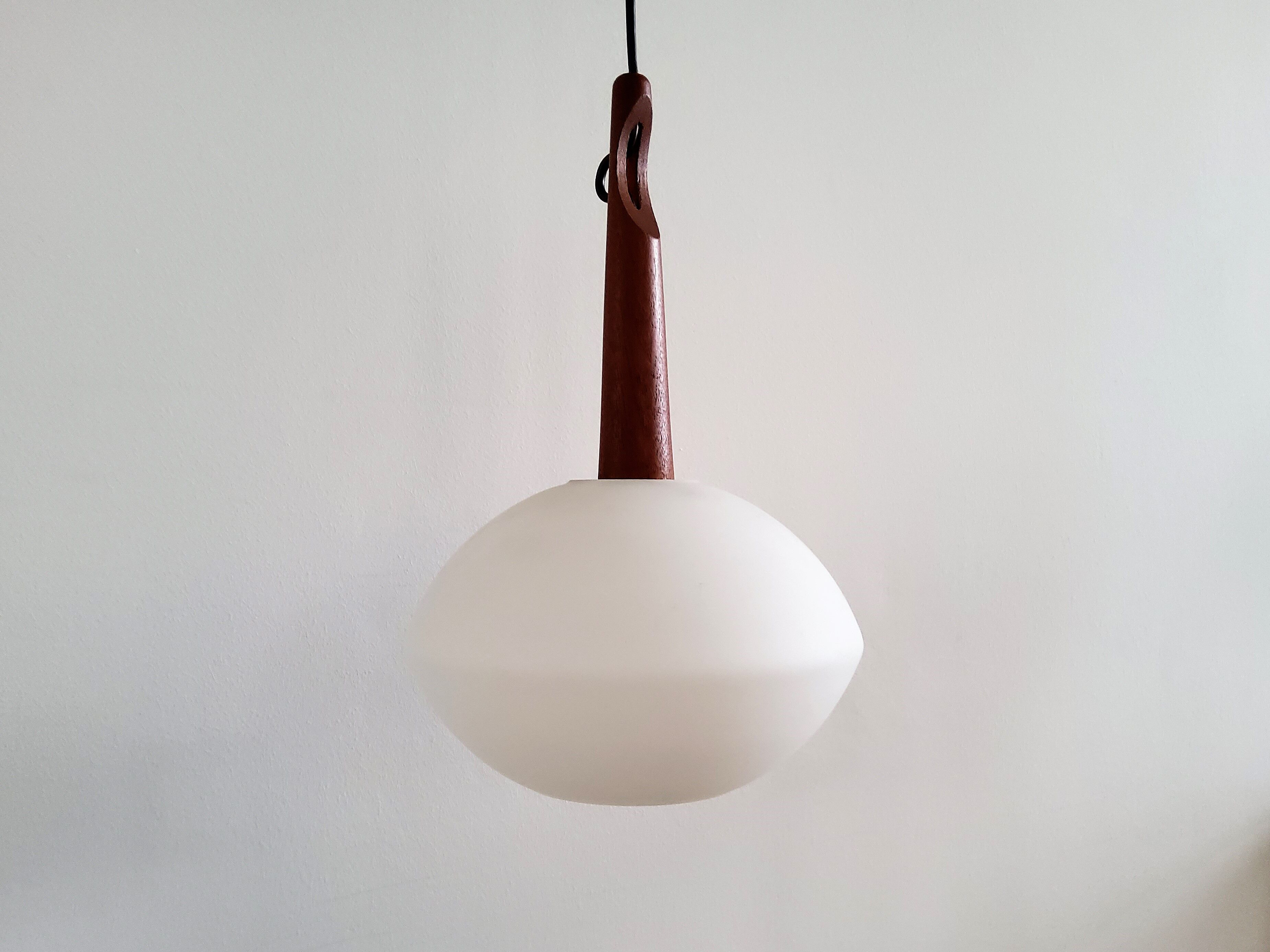 Teak and opaline glass pendant lamp by Uno and Östen Kristiansson for Luxus, Sweden 1950's