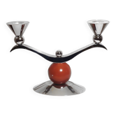 Memphis candle holder with a wooden ball decoration.