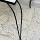 Vintage coffee table in wrought iron with floral tiles.