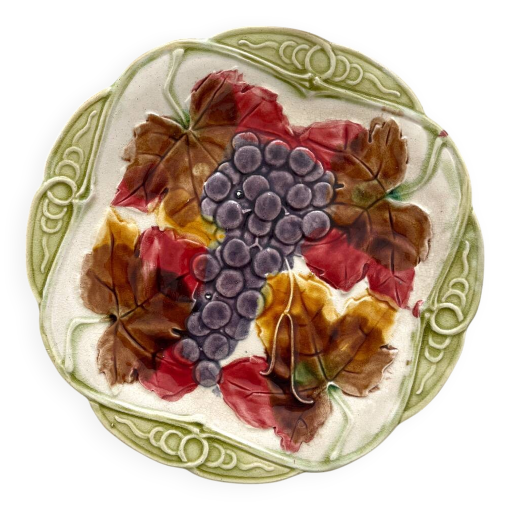 Antique plate in barbotine grapes and vine leaves from Orchies