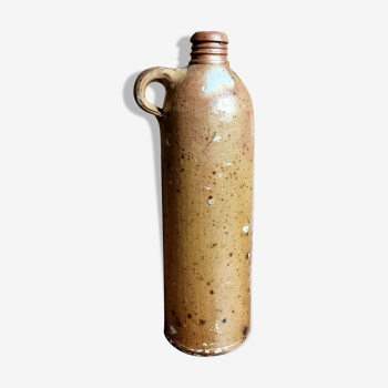 Bottle jug in ancient sandstone
