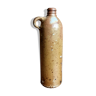 Bottle jug in ancient sandstone