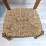 Vintage wooden and straw children's chair in a country style.