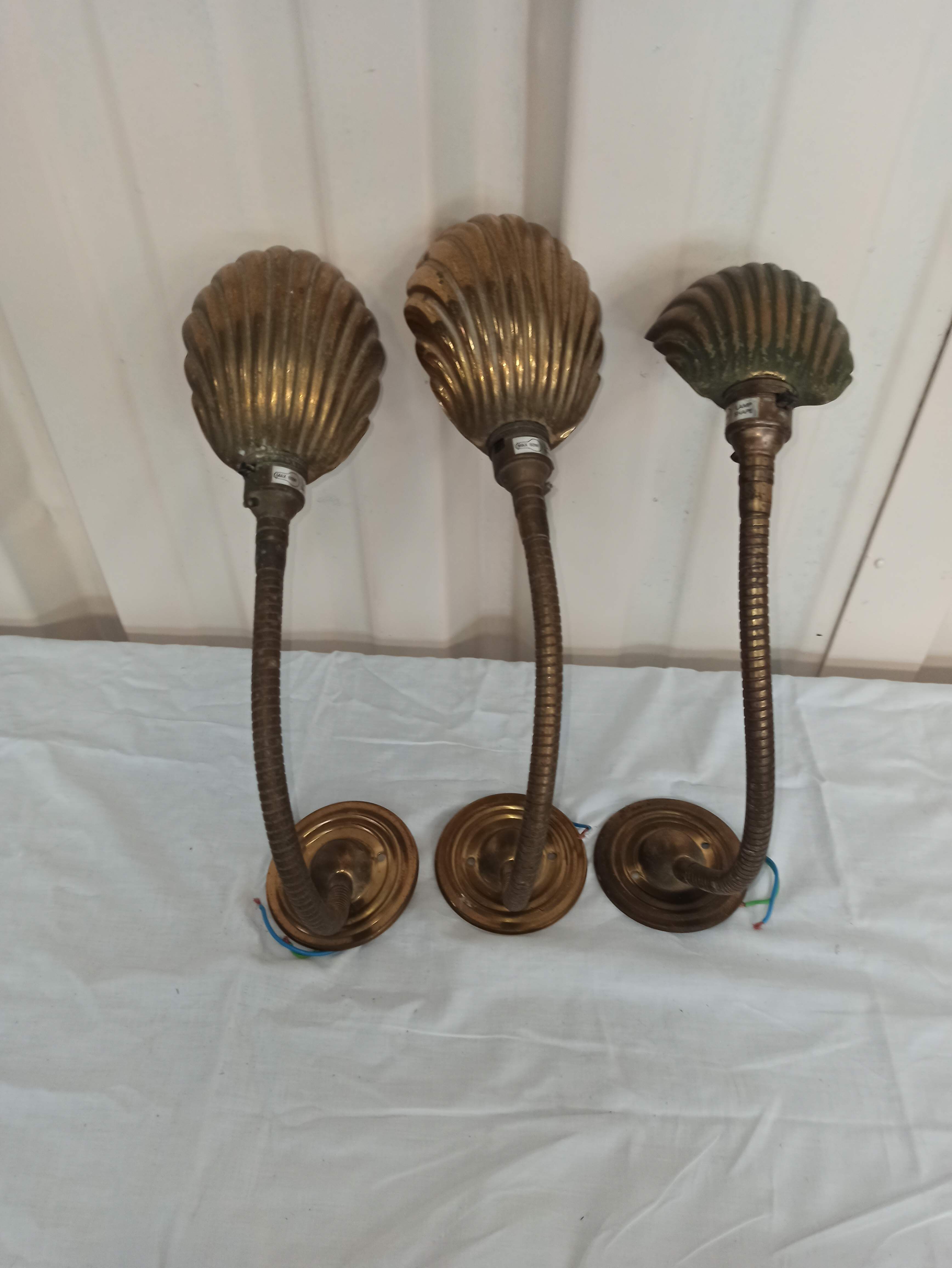 Trio of wall lamps Christopher Wray applies articulated lamp shell