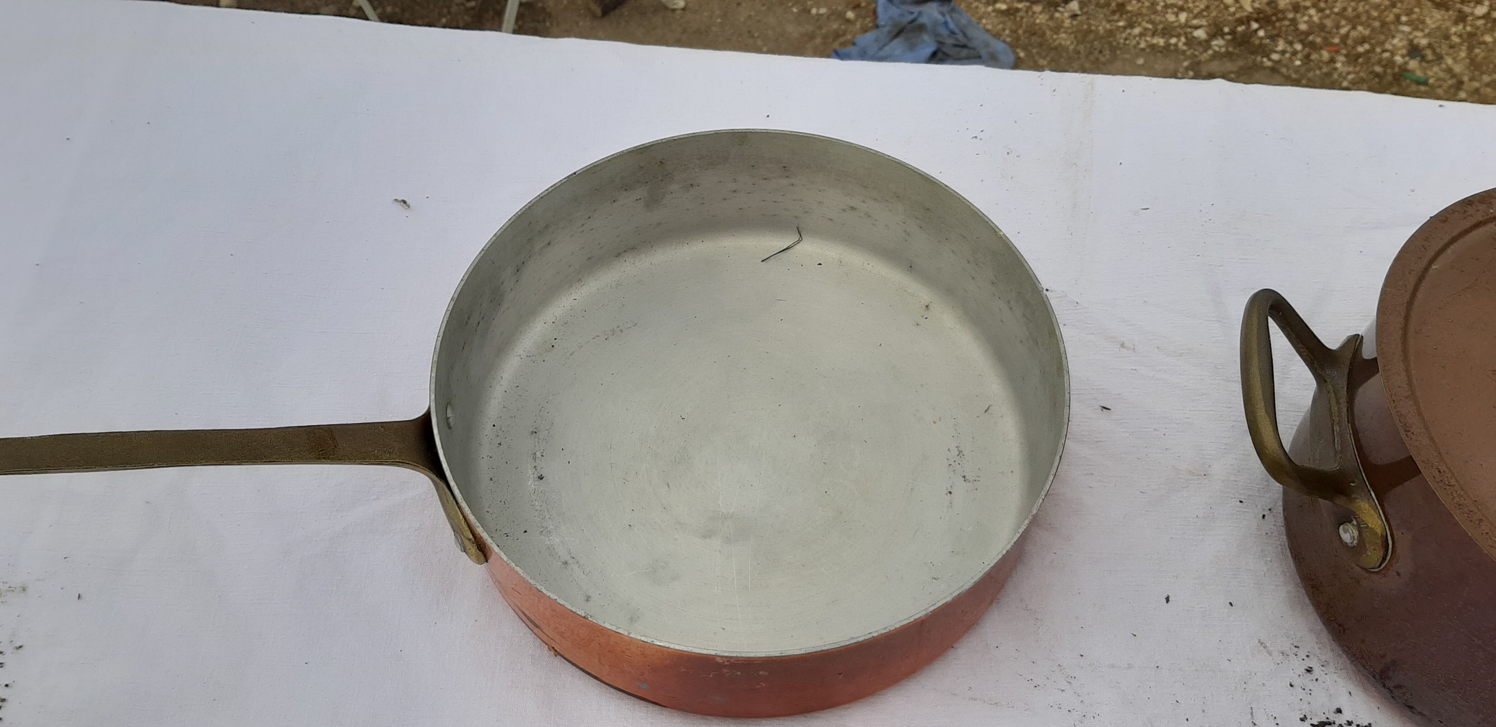 Lots of tinned copper kitchen utensils