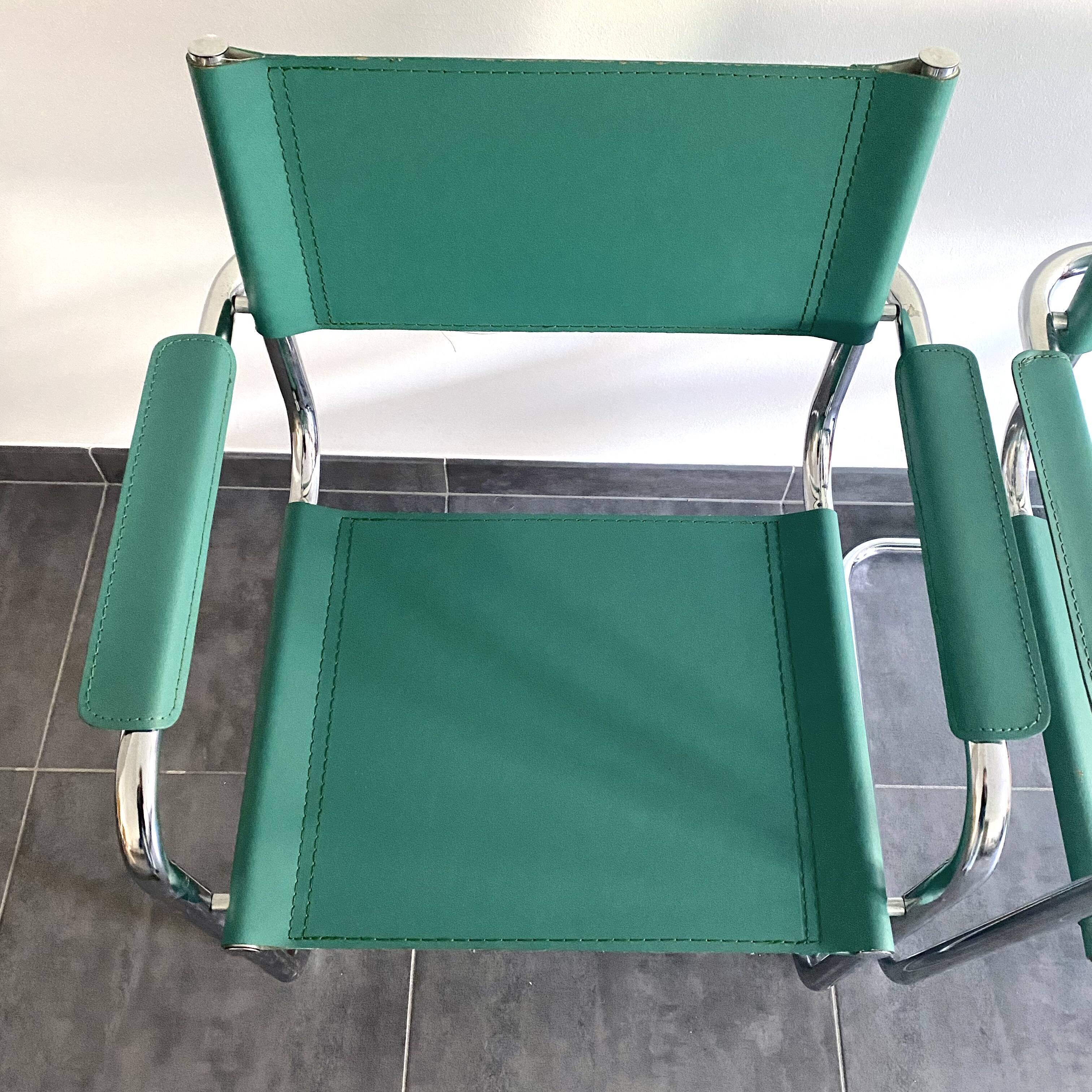 Pair of faux leather and chrome armchairs