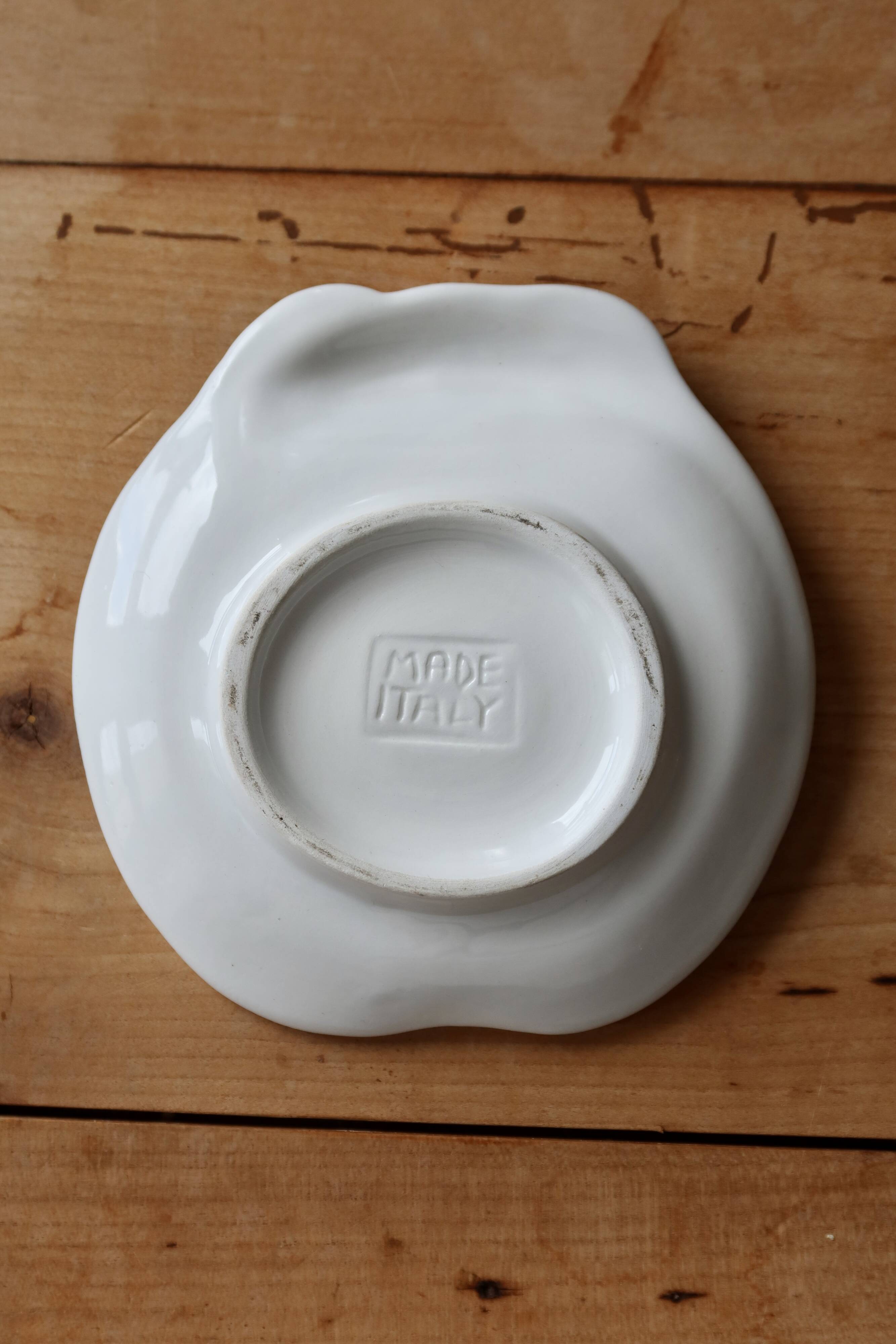 Small vintage barbotine bowl with peach-shaped pattern