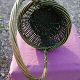 Green wicker basket with a large vintage handle
