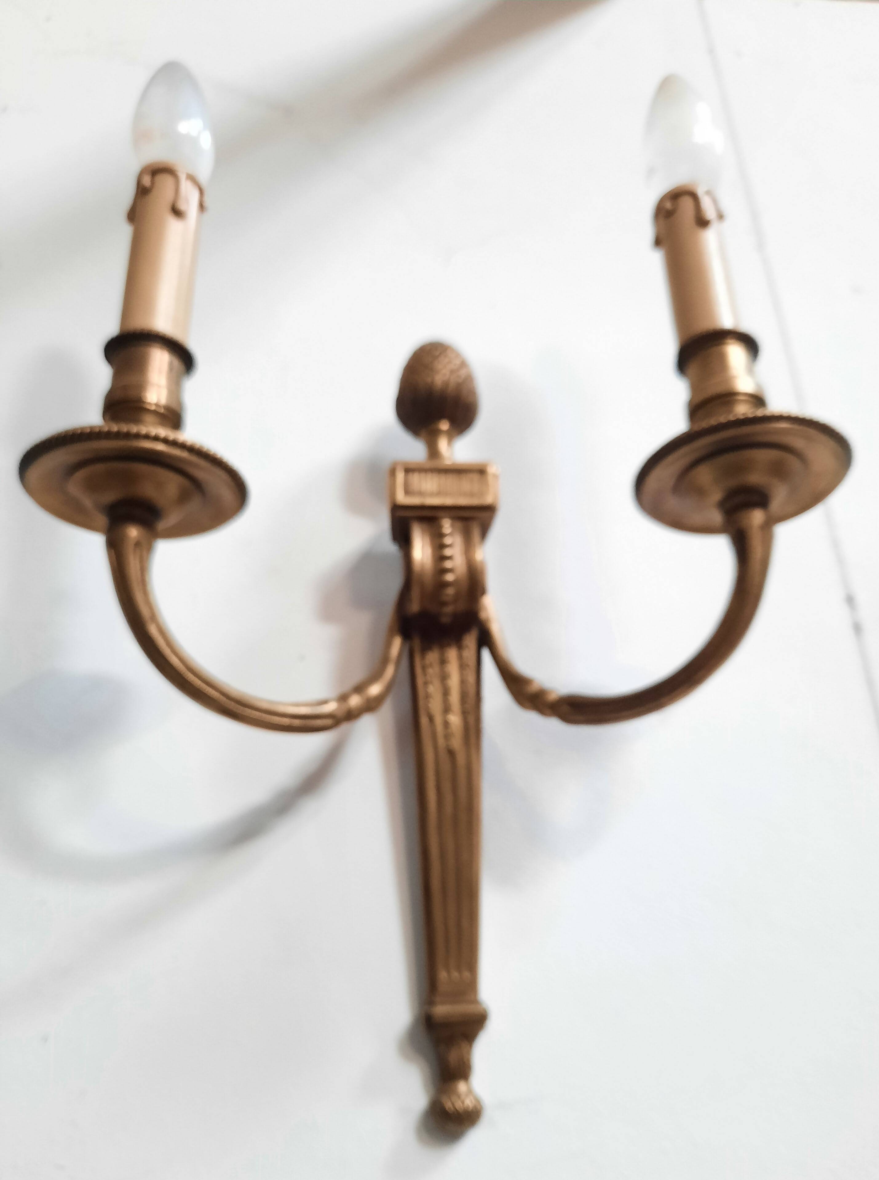 Pair of Louis XVI style bronze wall lights