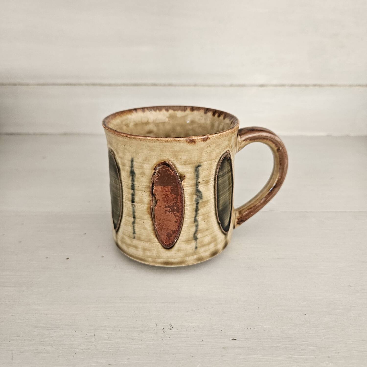 Set of 4 ceramic mugs, glazed stoneware, assorted vintage designs.