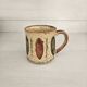 Set of 4 ceramic mugs, glazed stoneware, assorted vintage designs.