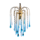 An ancient chandelier with blue tassels