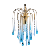 An ancient chandelier with blue tassels