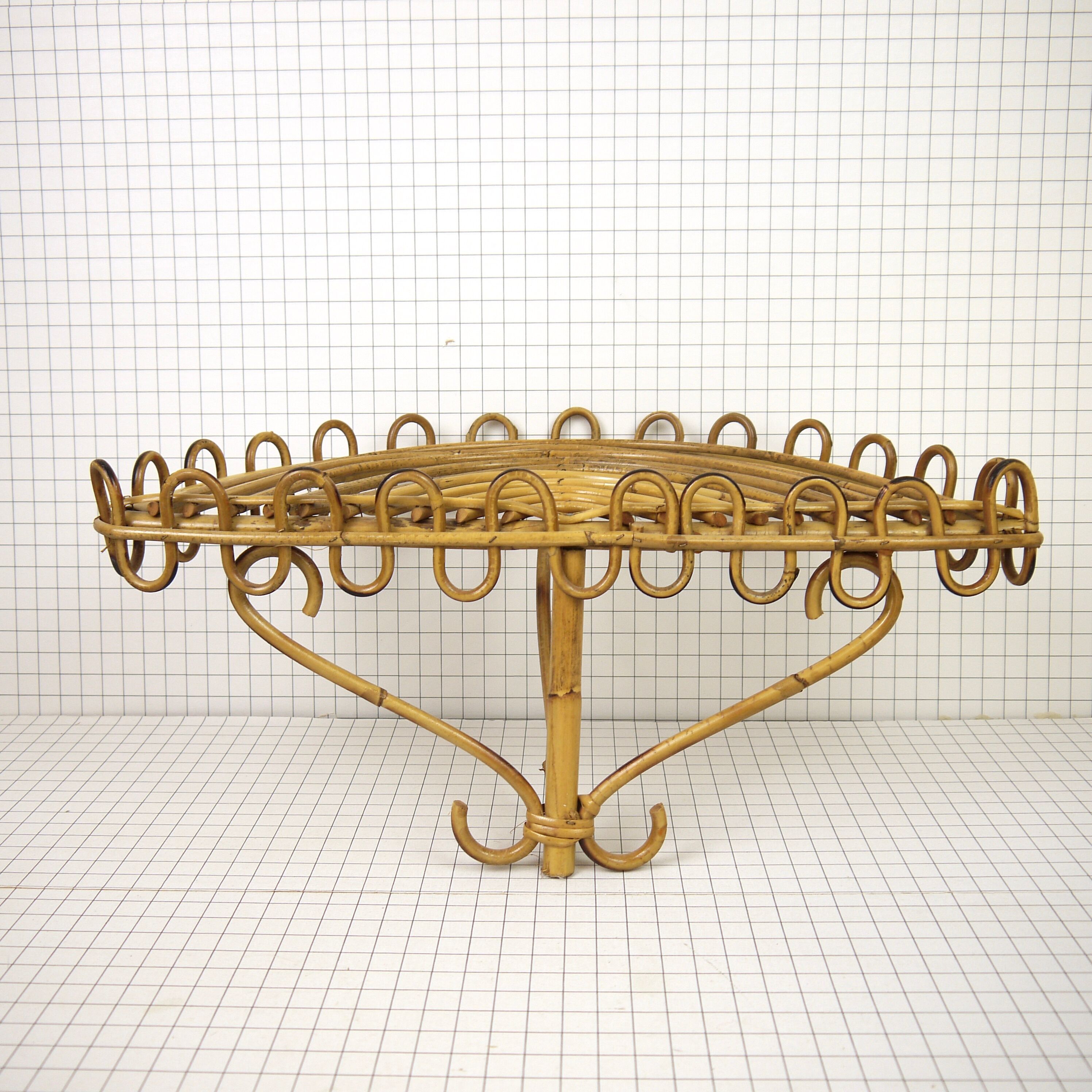 Half-moon rattan shelf and coat holder