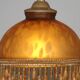 Vintage French amber mottled glass hanging ceiling light with beaded fringe.
