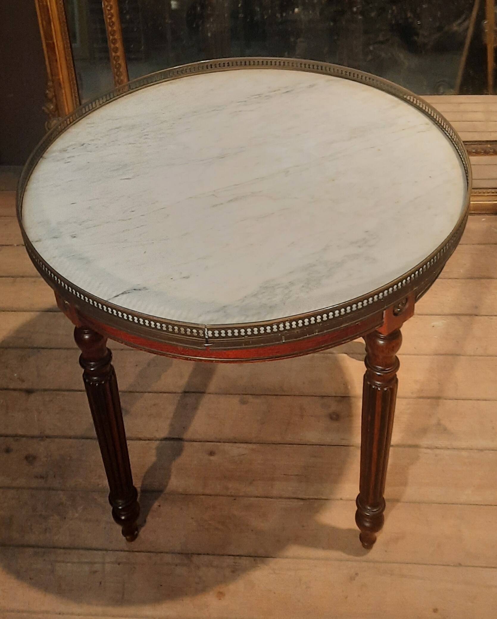 Coffee table with a marble top, known as "bouillotte".