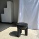 Black mango wood tripod side table with a semi-spherical top, height: 45 cm, diameter: 44 cm.