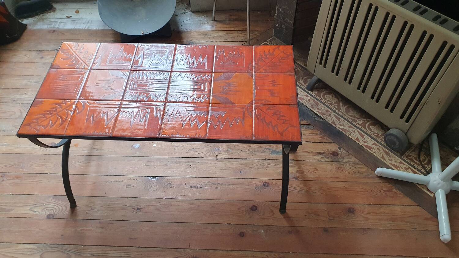 Wrought iron and orange ceramic coffee table
