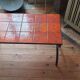 Table basse en fer forgé et céramique orange