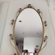 Miroir ovale en laiton doré et de cor floral, Années 1950