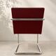 Vintage cantilever chair in chrome and burgundy fabric.