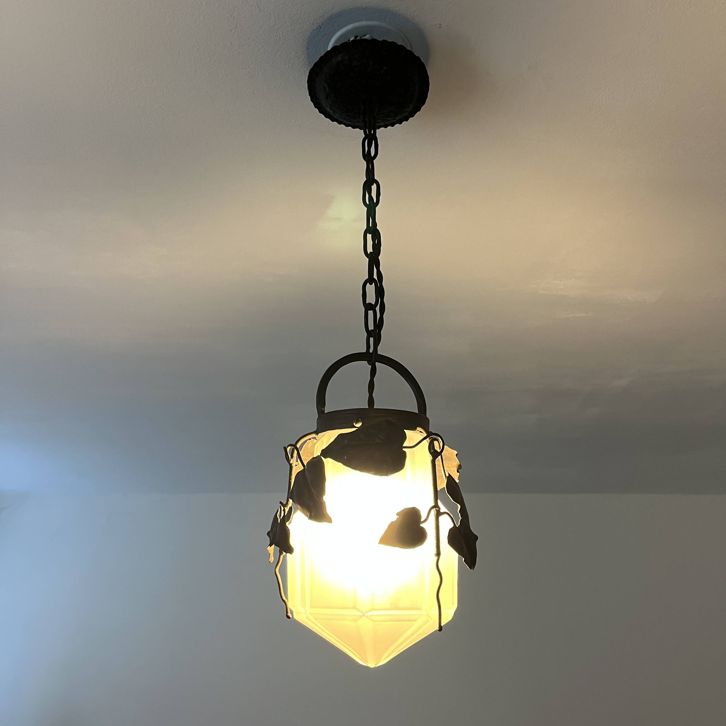 Antique glass and wrought iron pendant light with ivy decor Art Deco chandelier globe