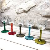 Antique and rare! Sold in a set of 12 colorful twisted stemmed glasses engraved with flowers and leaves