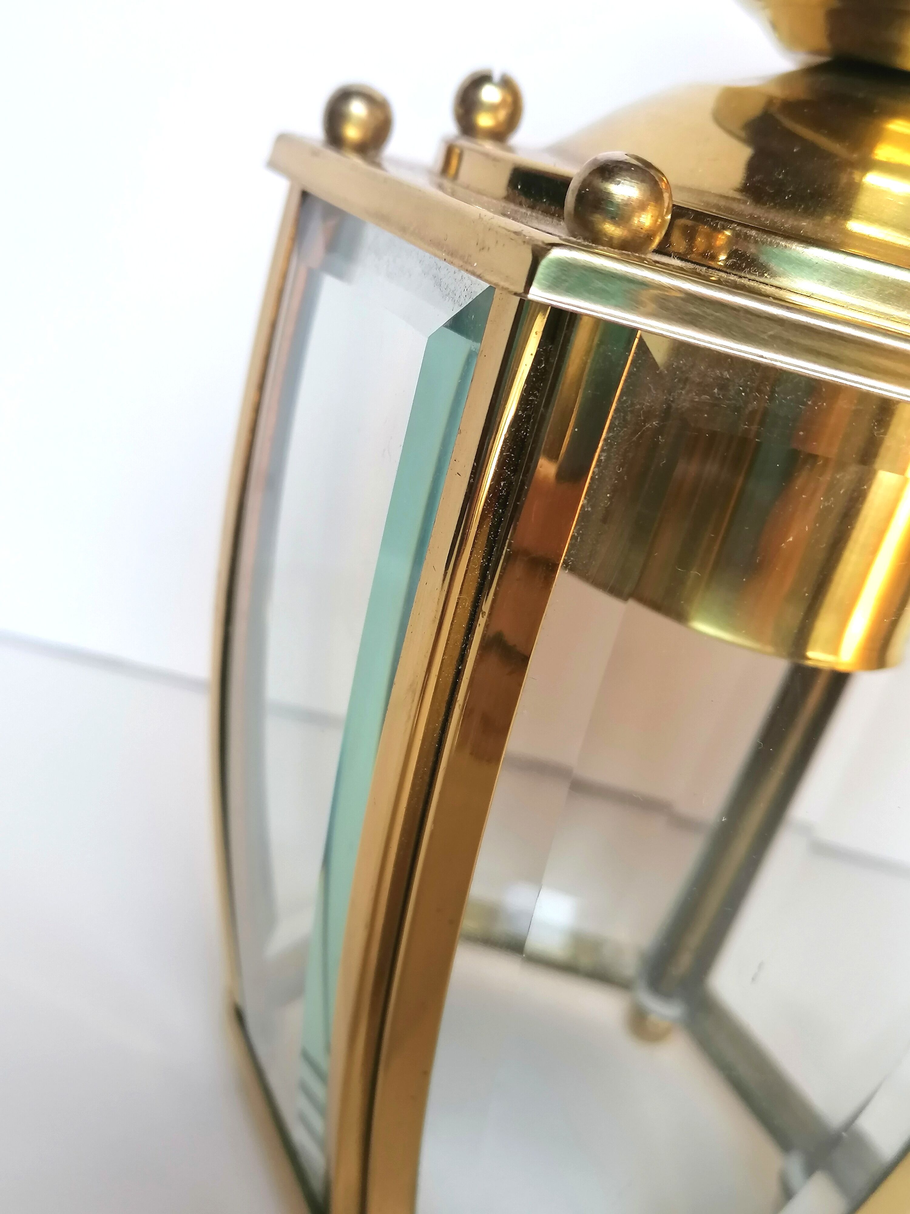 Golden hanging lamp with bevelled glasses