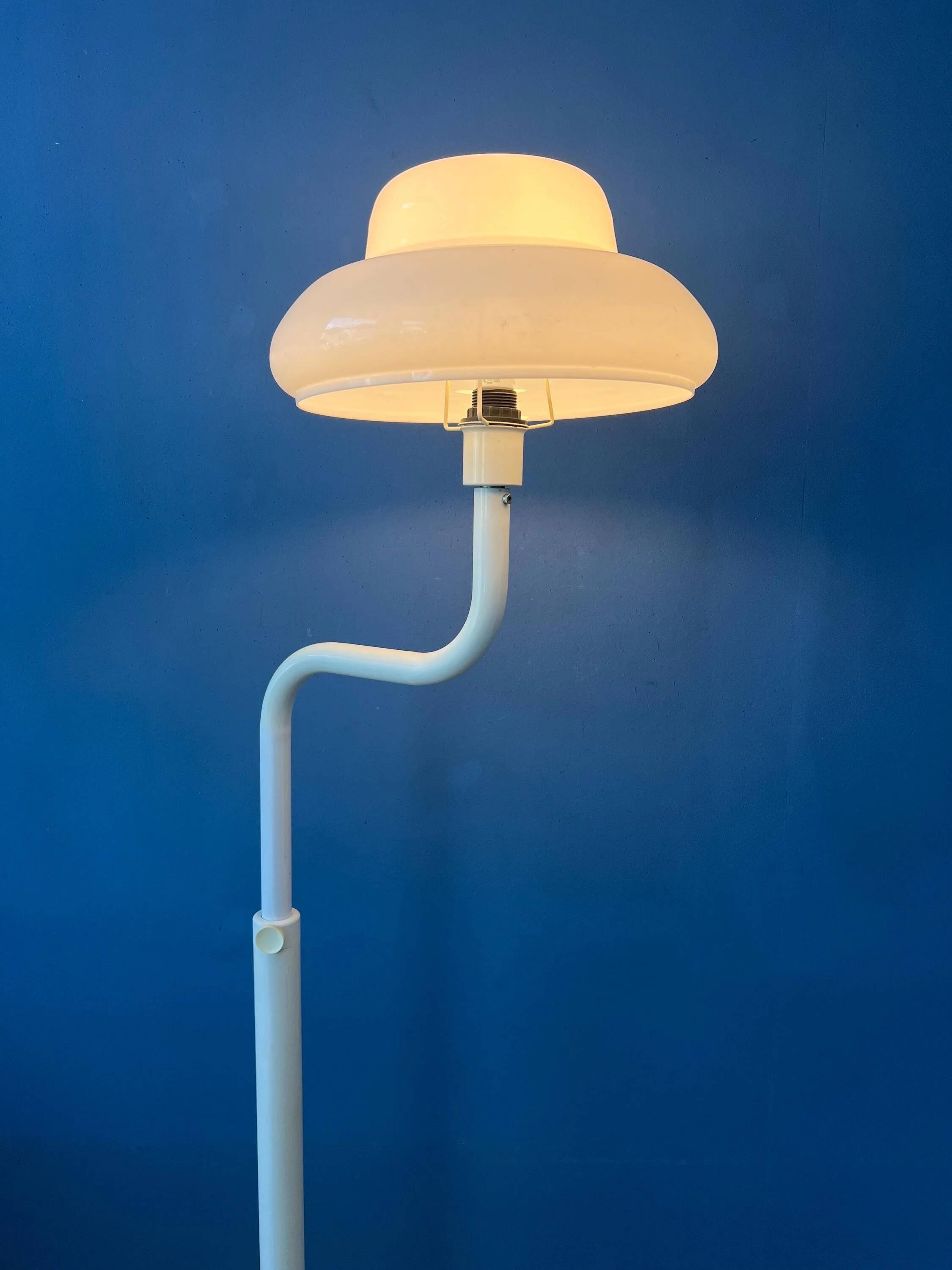 Mid-century mushroom floor lamp with a white plexiglass shade.